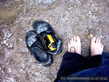 Bare feet, sandals and a GPS receiver Bare feet, sandals and a GPS receiver