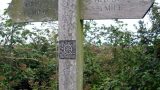 A decoratively-illustrated finger post shows the Pirton/Hitchin route